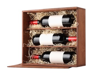 Photo of Wooden gift box with wine bottles isolated on white