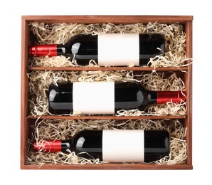 Wooden gift box with wine bottles isolated on white