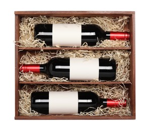 Wooden gift box with wine bottles isolated on white