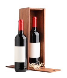 Photo of Wooden gift box with wine isolated on white