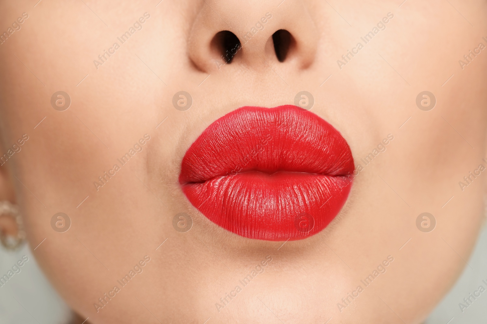 Photo of Closeup view of woman with red lipstick