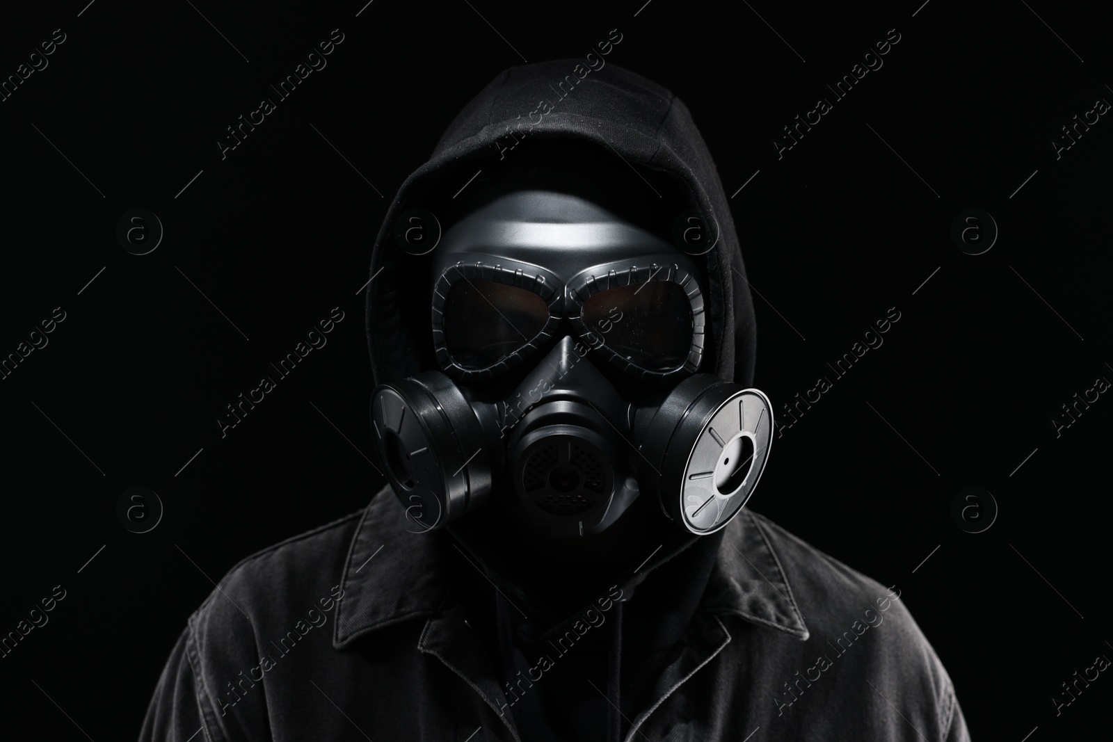 Photo of Man in gas mask on black background