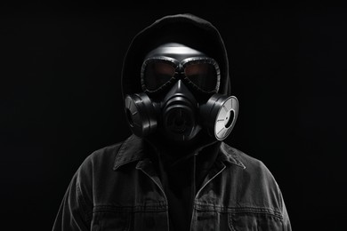 Photo of Man in gas mask on black background