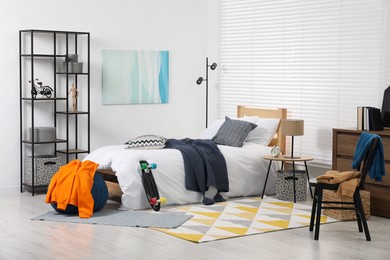 Photo of Teen's room interior with modern furniture and beautiful picture on wall