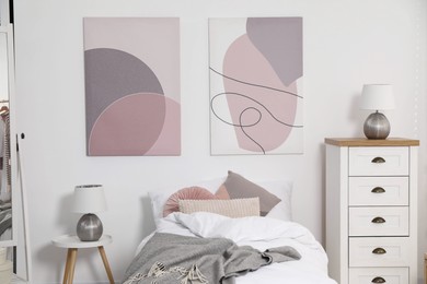 Teen's room interior with modern furniture and beautiful pictures on wall
