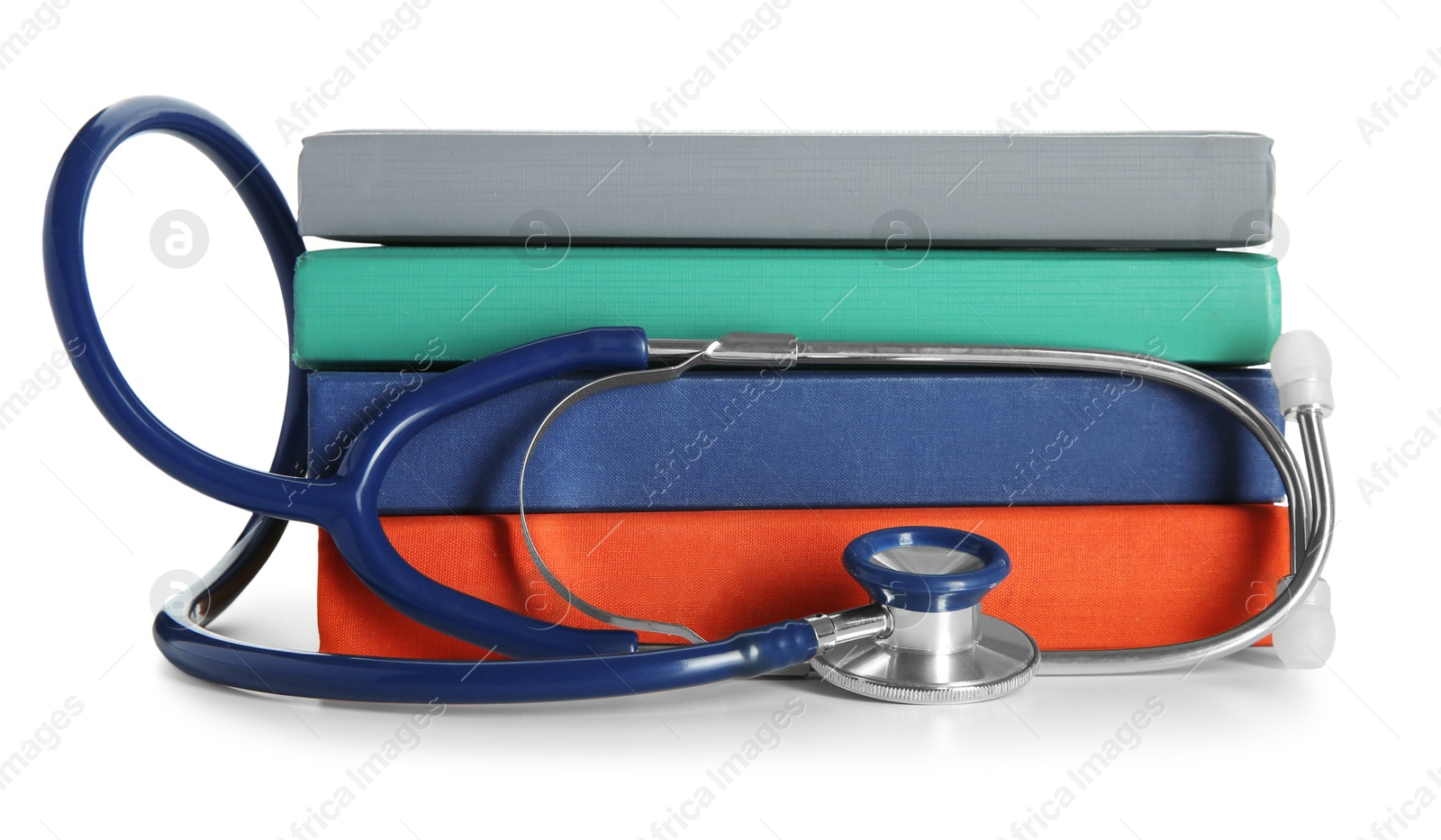 Photo of Stethoscope and stack of books isolated on white