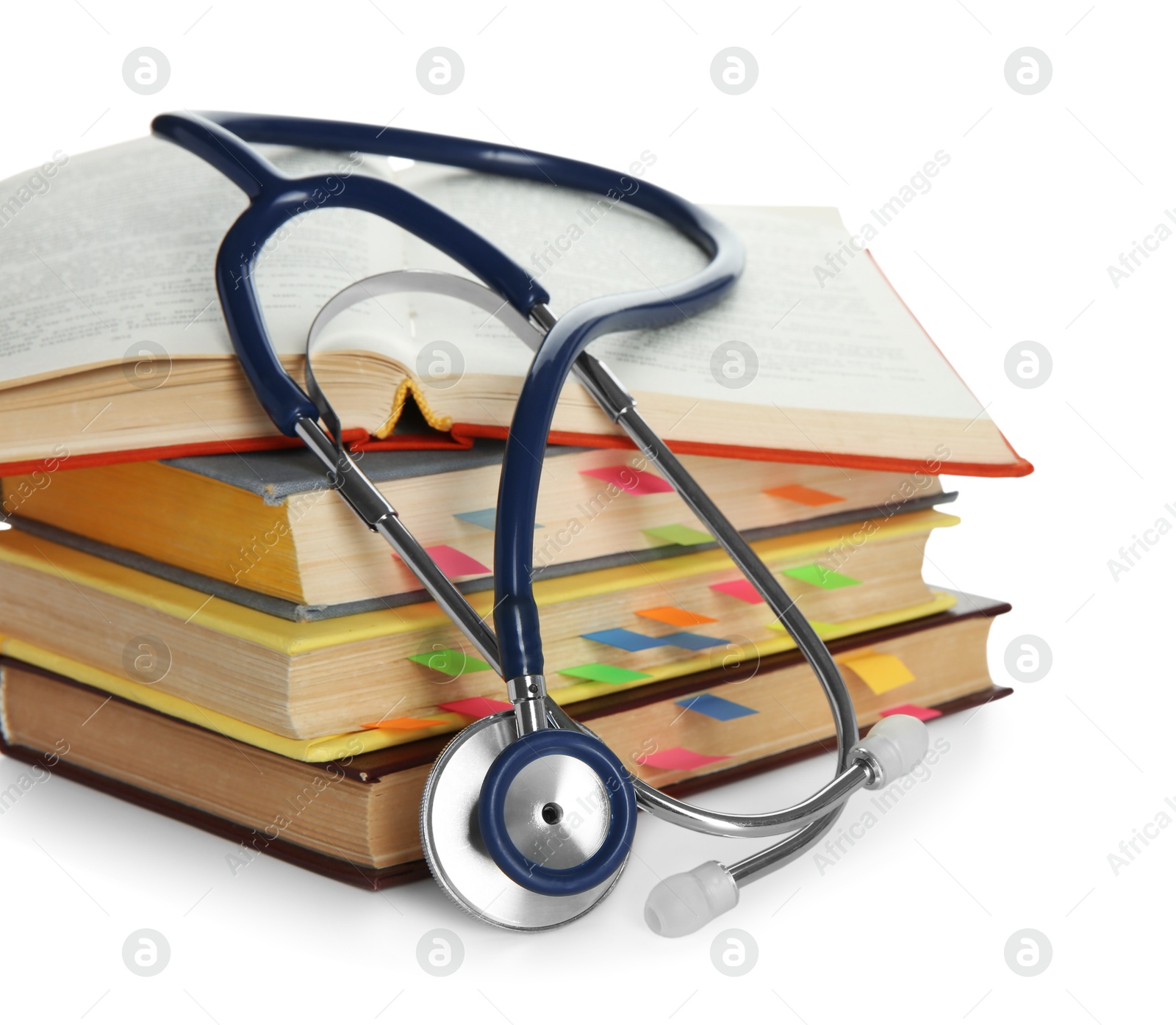 Photo of Stethoscope on stack of books against white background