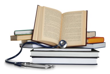 Photo of Stethoscope and stack of books isolated on white