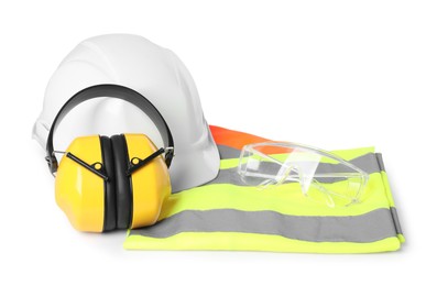 Photo of Hard hat, earmuffs, protective goggles and reflective vest isolated on white