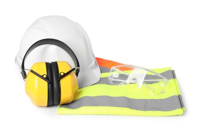 Hard hat, earmuffs, protective goggles and reflective vest isolated on white