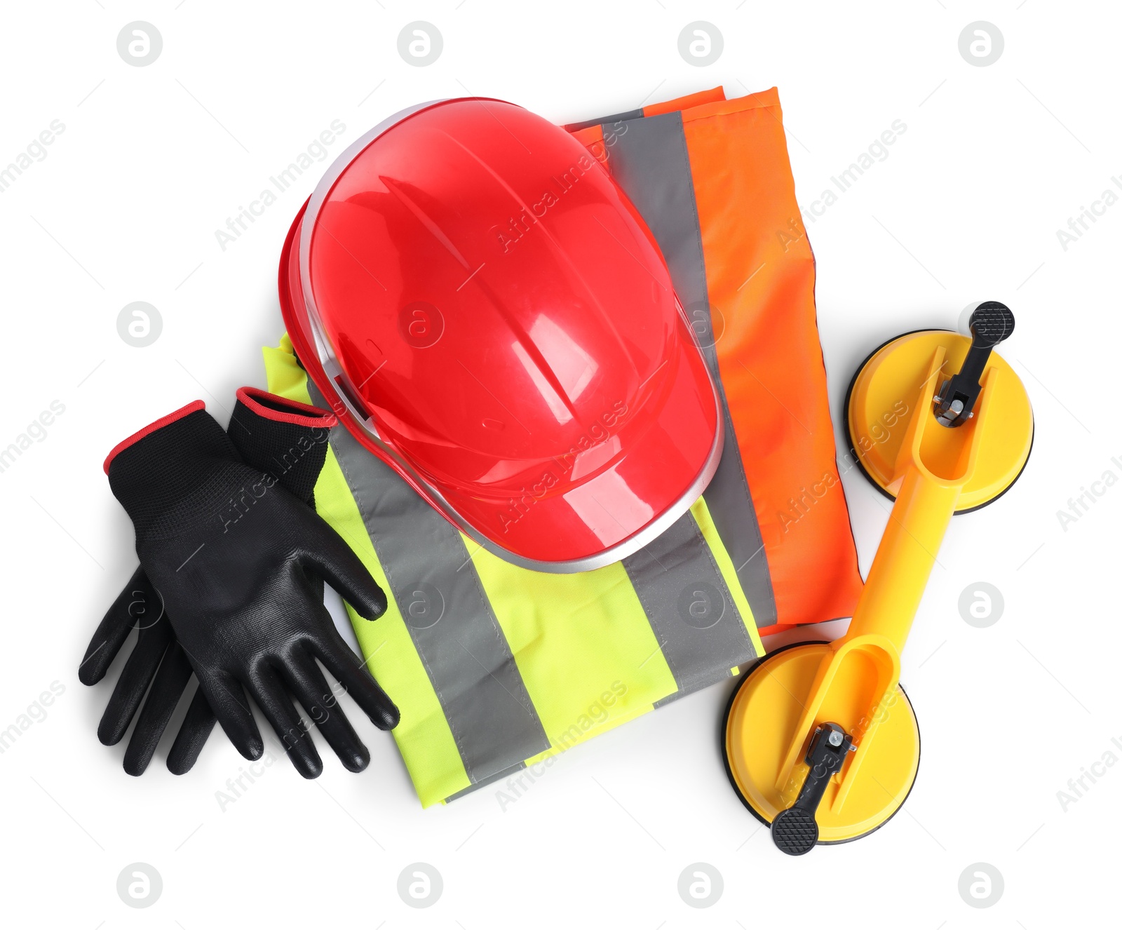 Photo of Hard hat, protective gloves, glass suction cups and reflective vest isolated on white, top view