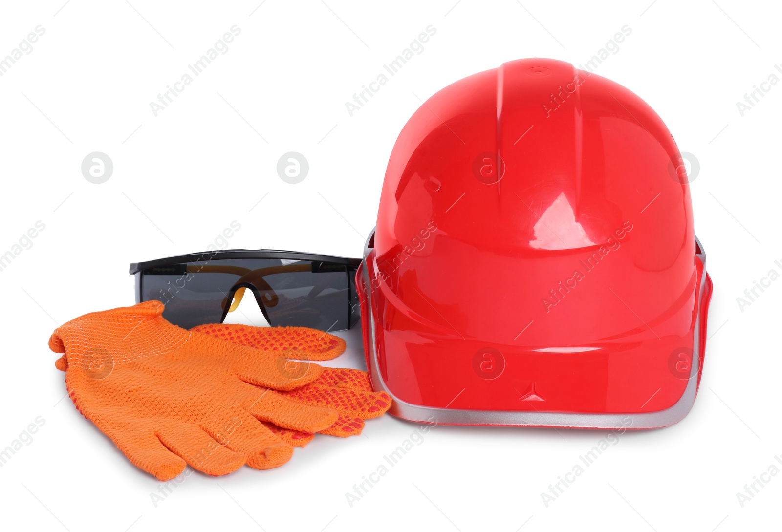 Photo of Hard hat, goggles and protective gloves isolated on white