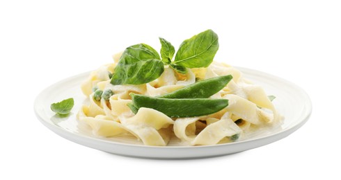 Photo of Delicious pasta with green peas and creamy sauce isolated on white