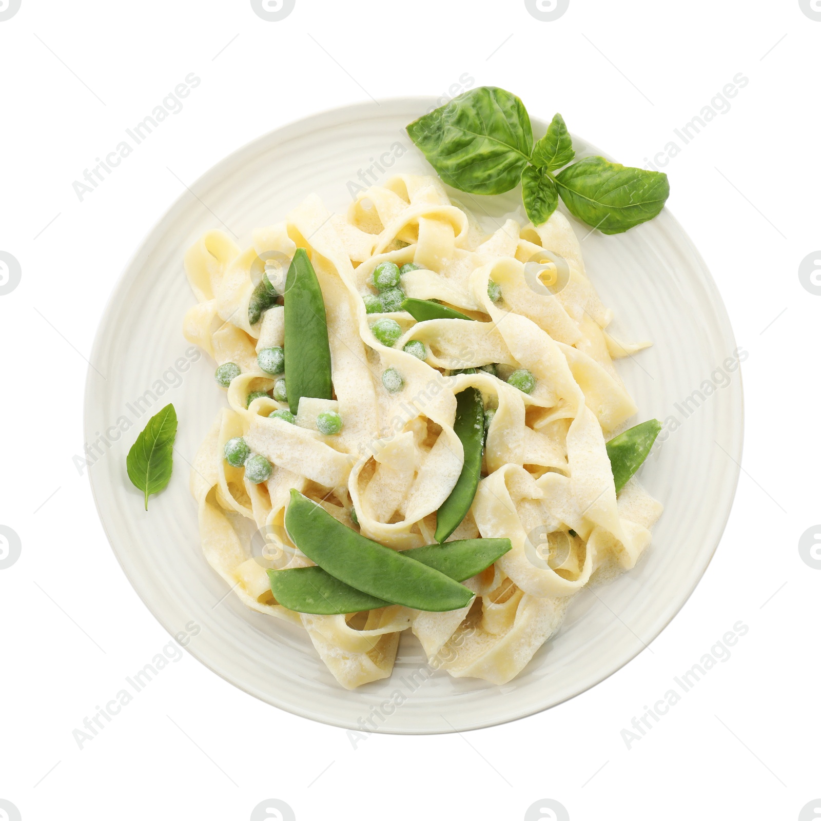 Photo of Delicious pasta with green peas and creamy sauce isolated on white, top view