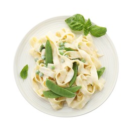 Delicious pasta with green peas and creamy sauce isolated on white, top view