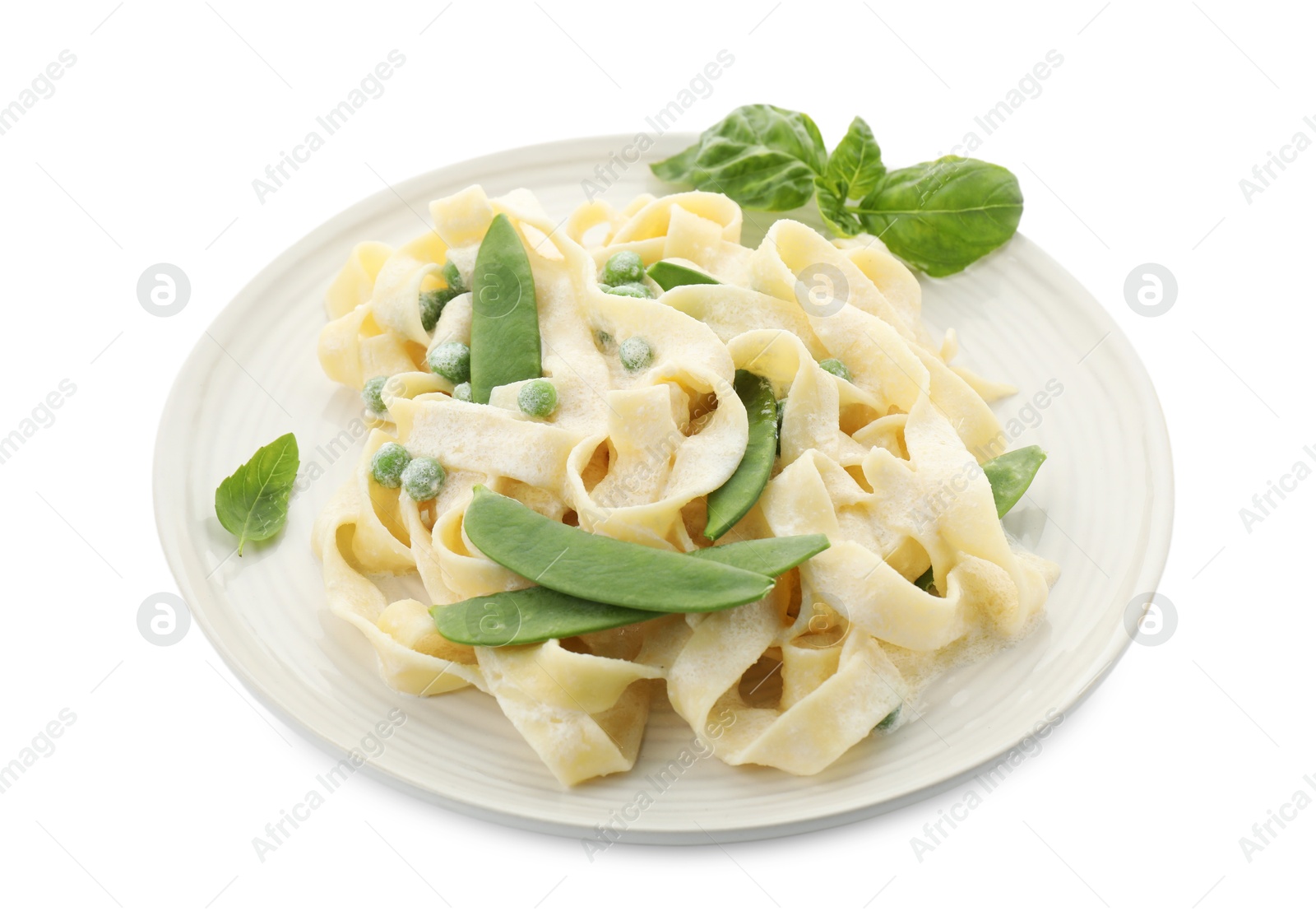 Photo of Delicious pasta with green peas and creamy sauce isolated on white