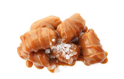 Yummy candies with caramel sauce and sea salt isolated on white, top view