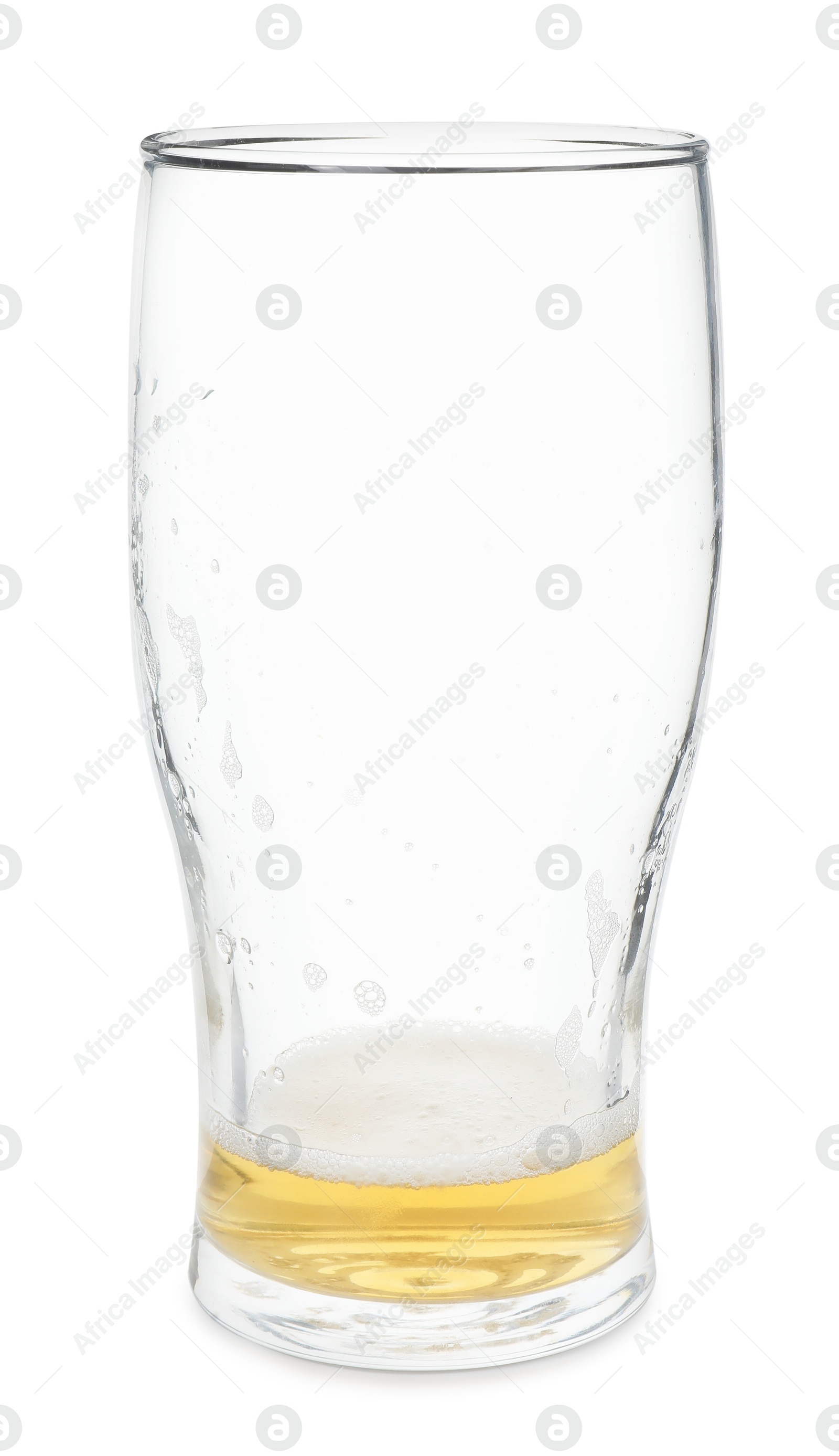 Photo of Almost empty glass of beer isolated on white