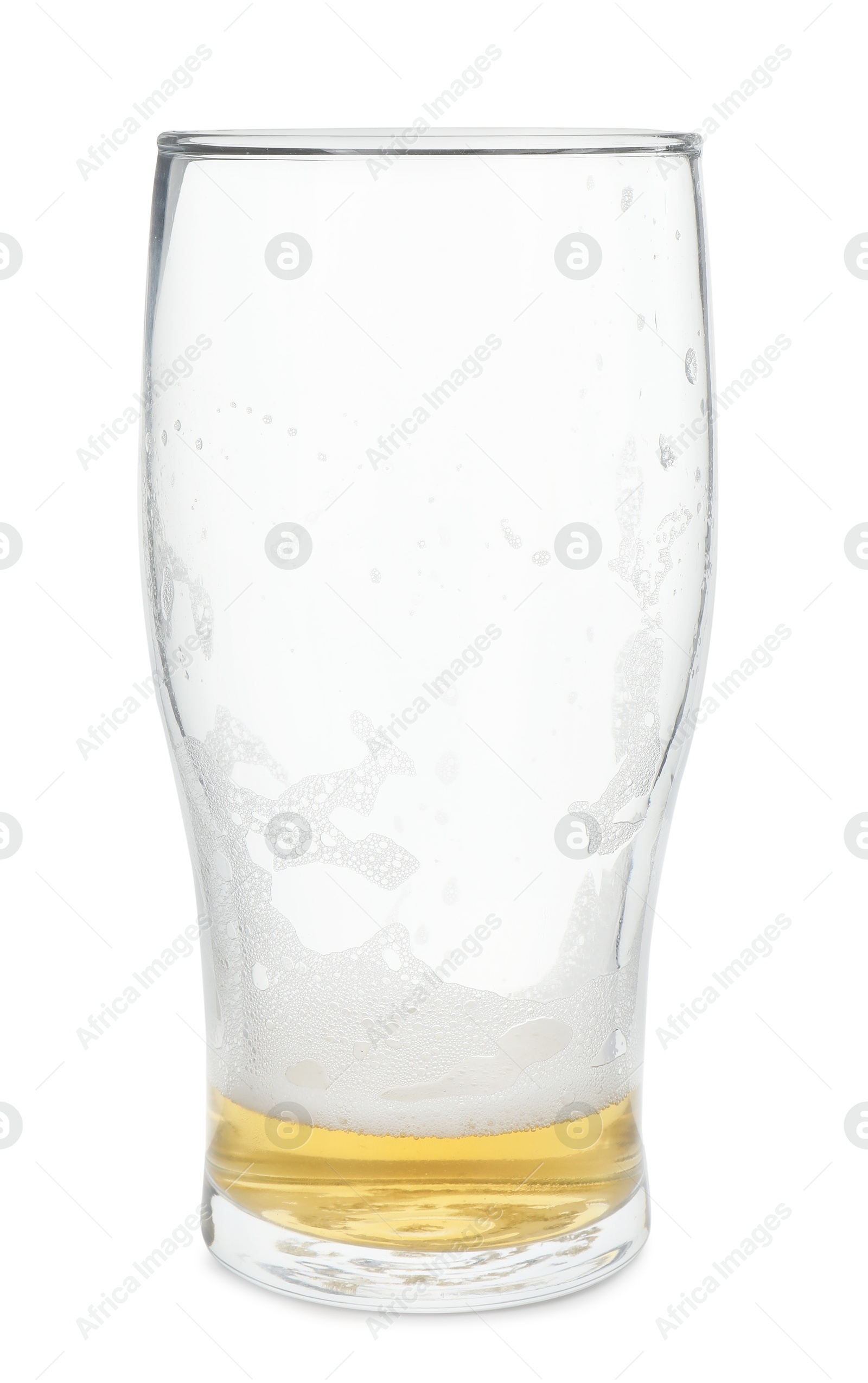 Photo of Almost empty glass of beer isolated on white