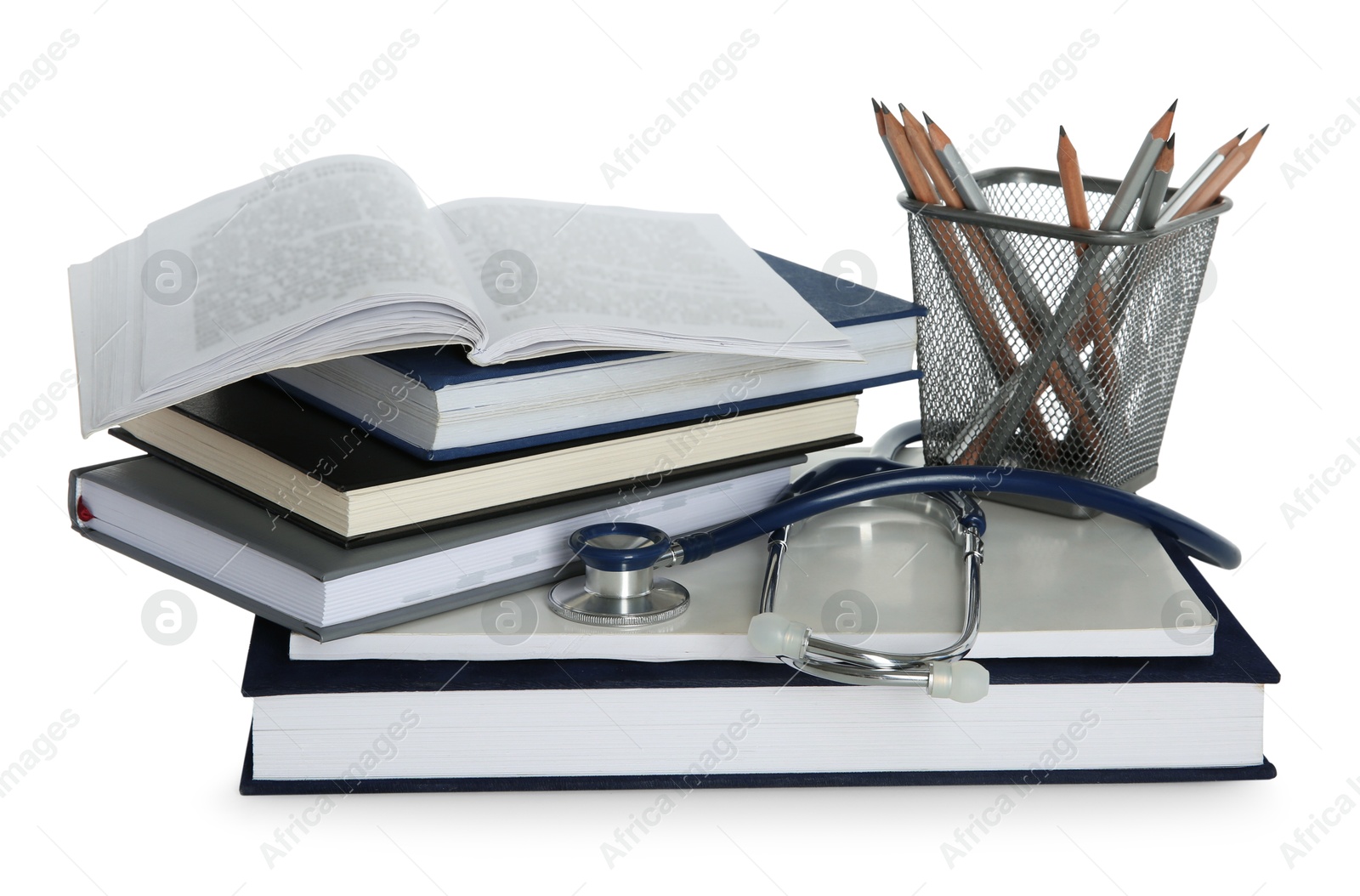 Photo of Stethoscope, stack of books and pencils isolated on white