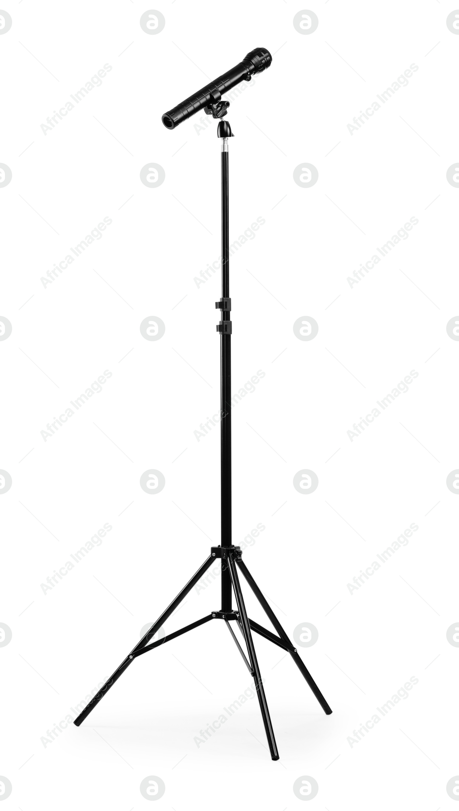 Photo of Tripod with spotlight isolated on white. Photo studio equipment