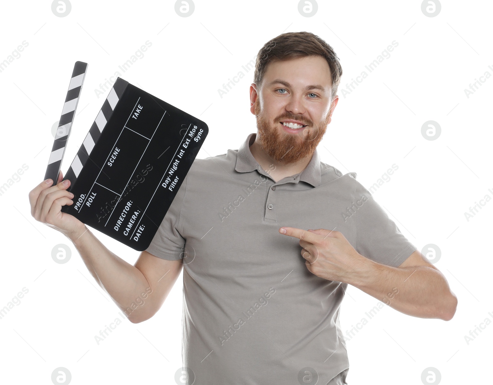 Photo of Making movie. Smiling man pointing at clapperboard on white background