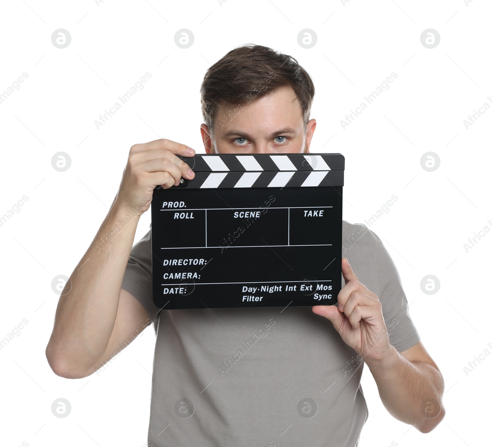 Photo of Making movie. Man with clapperboard on white background