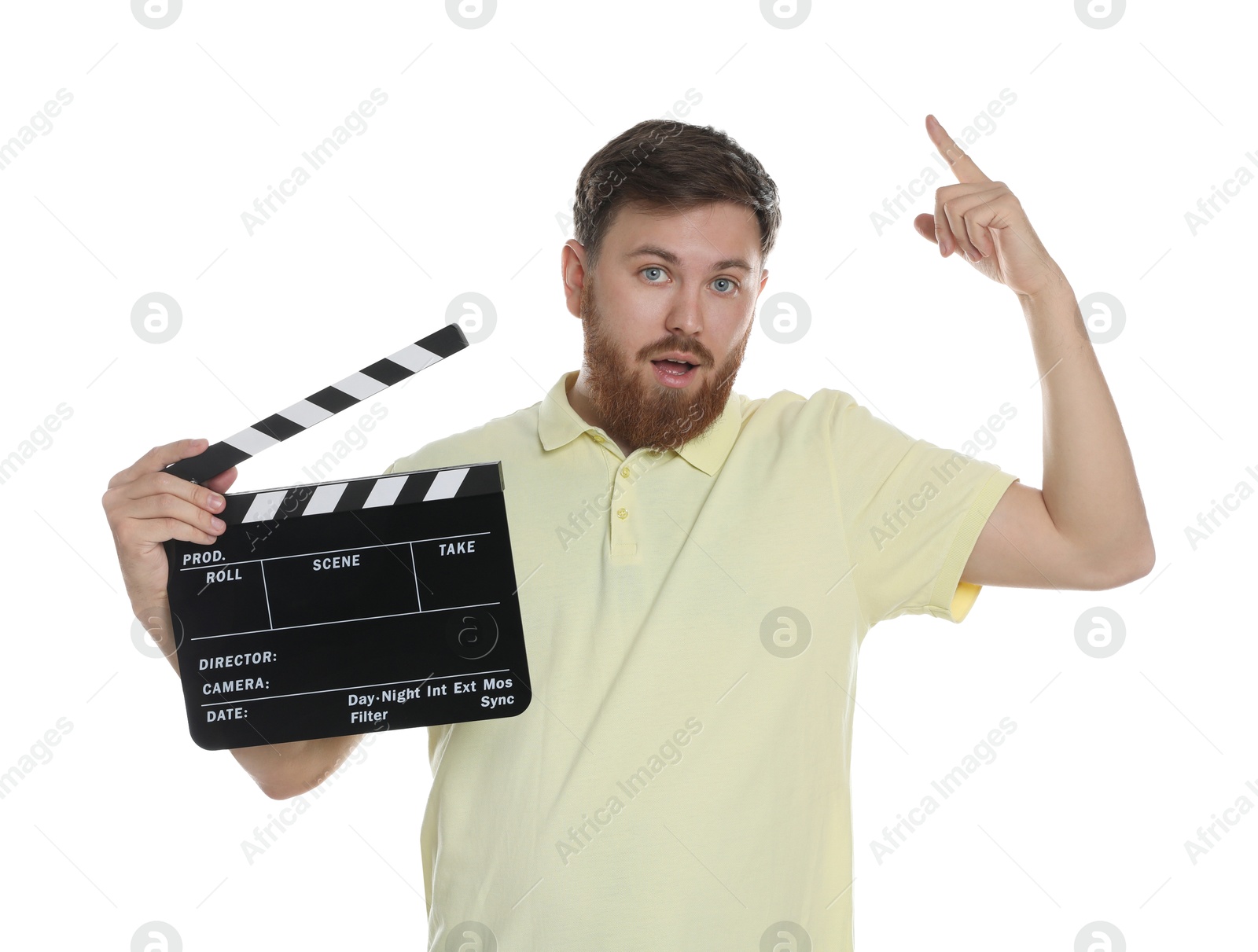 Photo of Making movie. Man with clapperboard pointing at something on white background