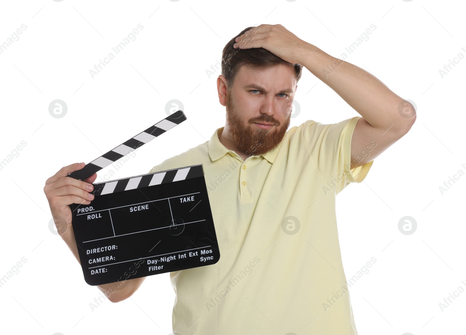 Photo of Making movie. Confused man with clapperboard on white background