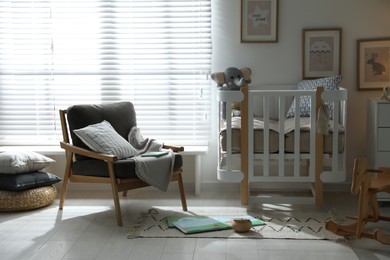 Baby room interior with crib and armchair. Idea for design