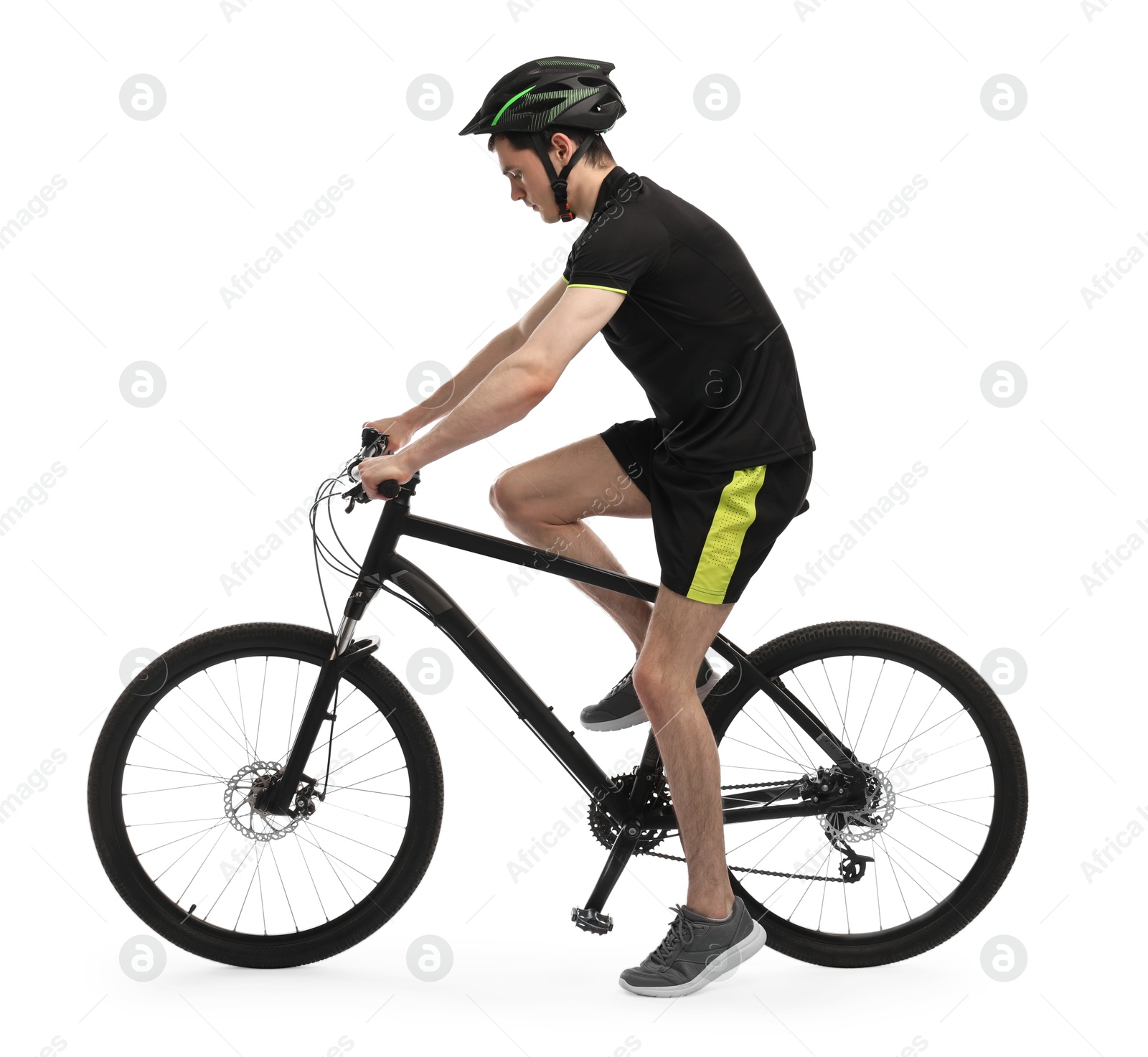 Photo of Man in helmet riding bicycle on white background