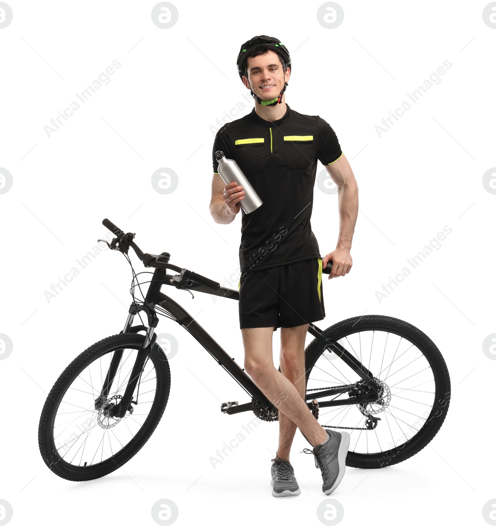 Photo of Smiling man in helmet with bottle of drink near bicycle isolated on white