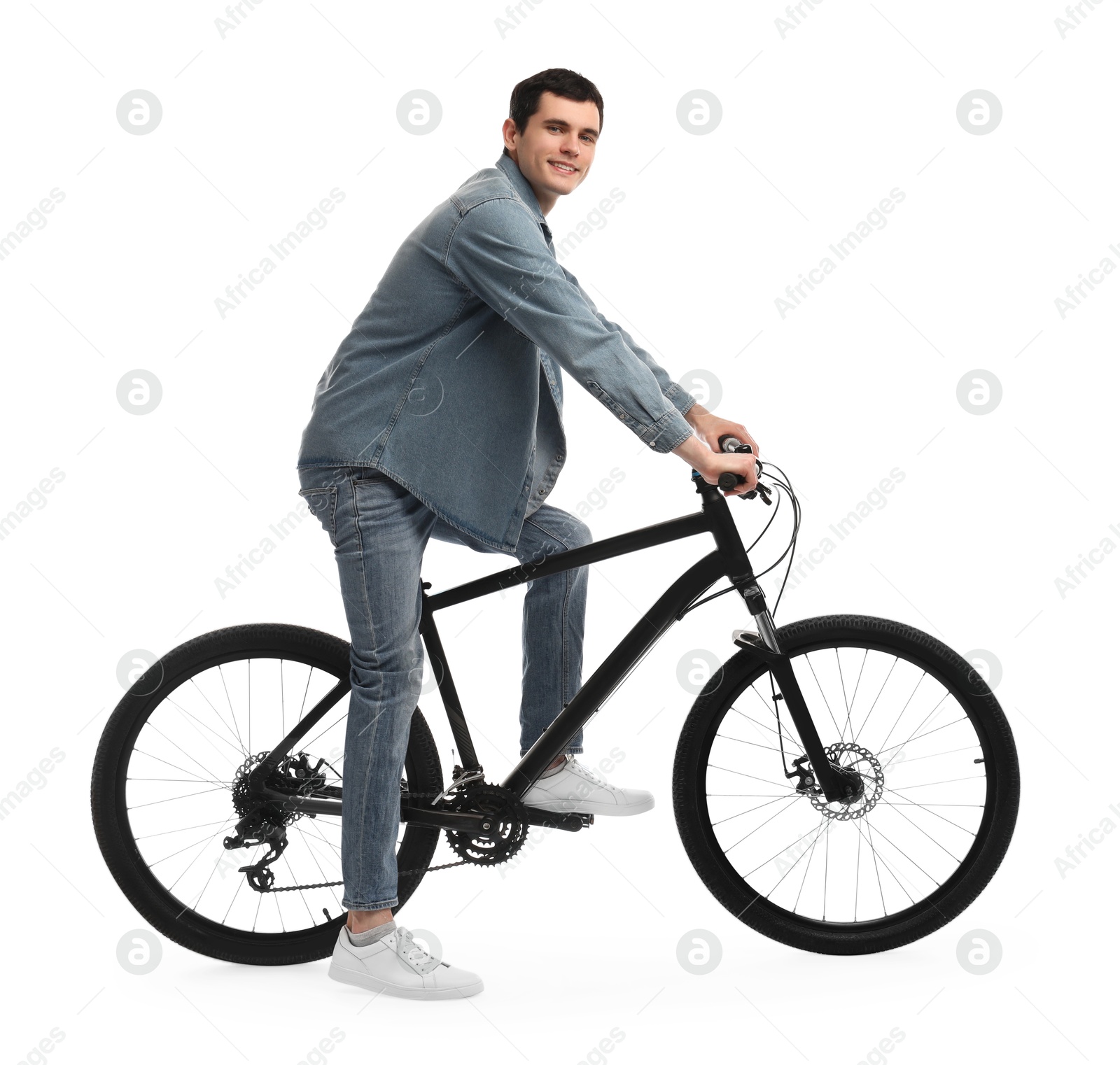 Photo of Smiling man riding bicycle on white background