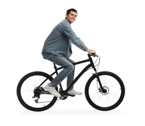 Smiling man riding bicycle on white background