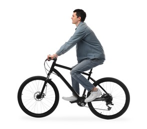 Young man riding bicycle on white background