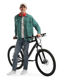 Smiling man with headphones near bicycle isolated on white