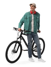 Smiling man with headphones near bicycle isolated on white