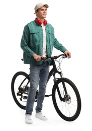 Smiling man with headphones near bicycle isolated on white