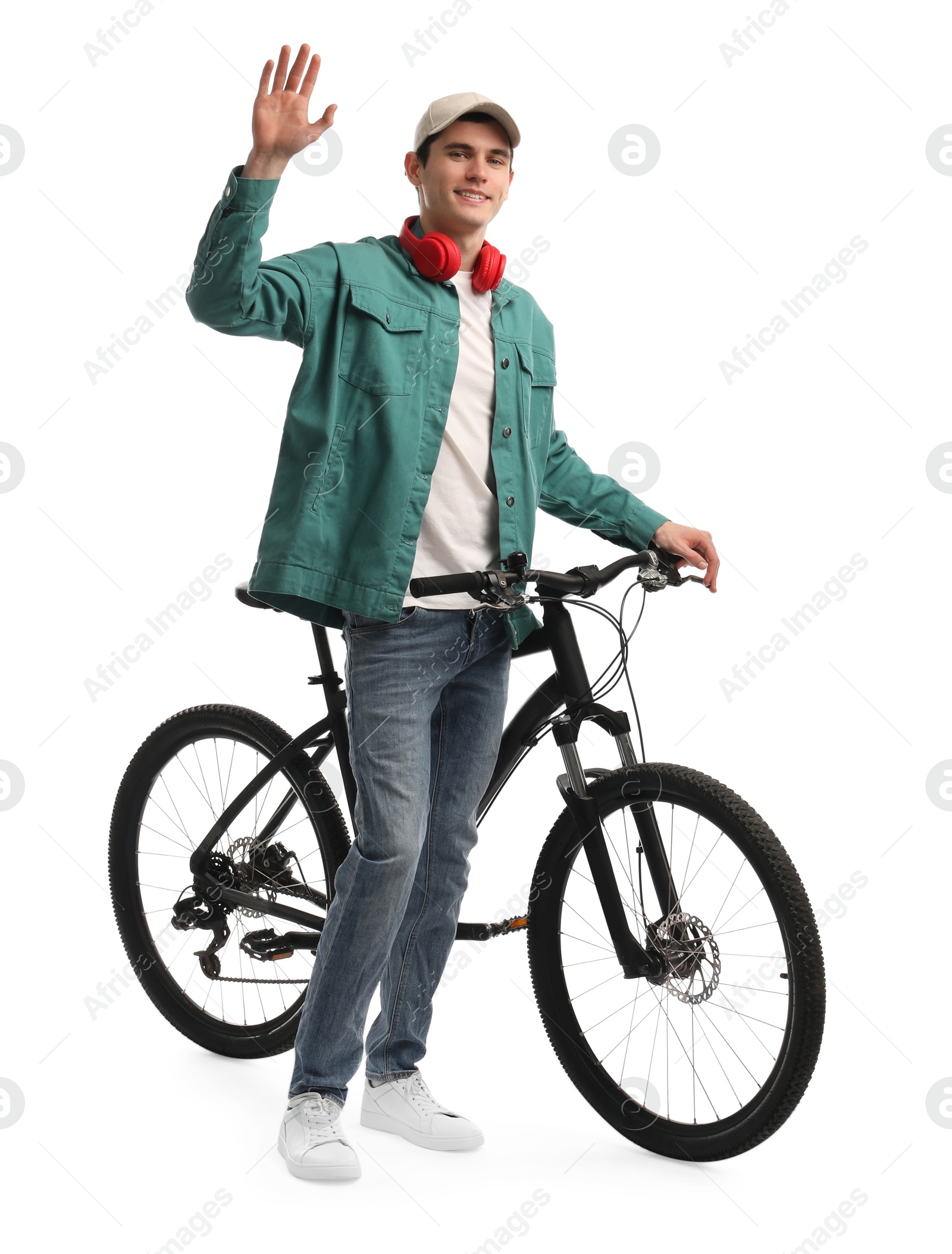 Photo of Smiling man with headphones and bicycle isolated on white