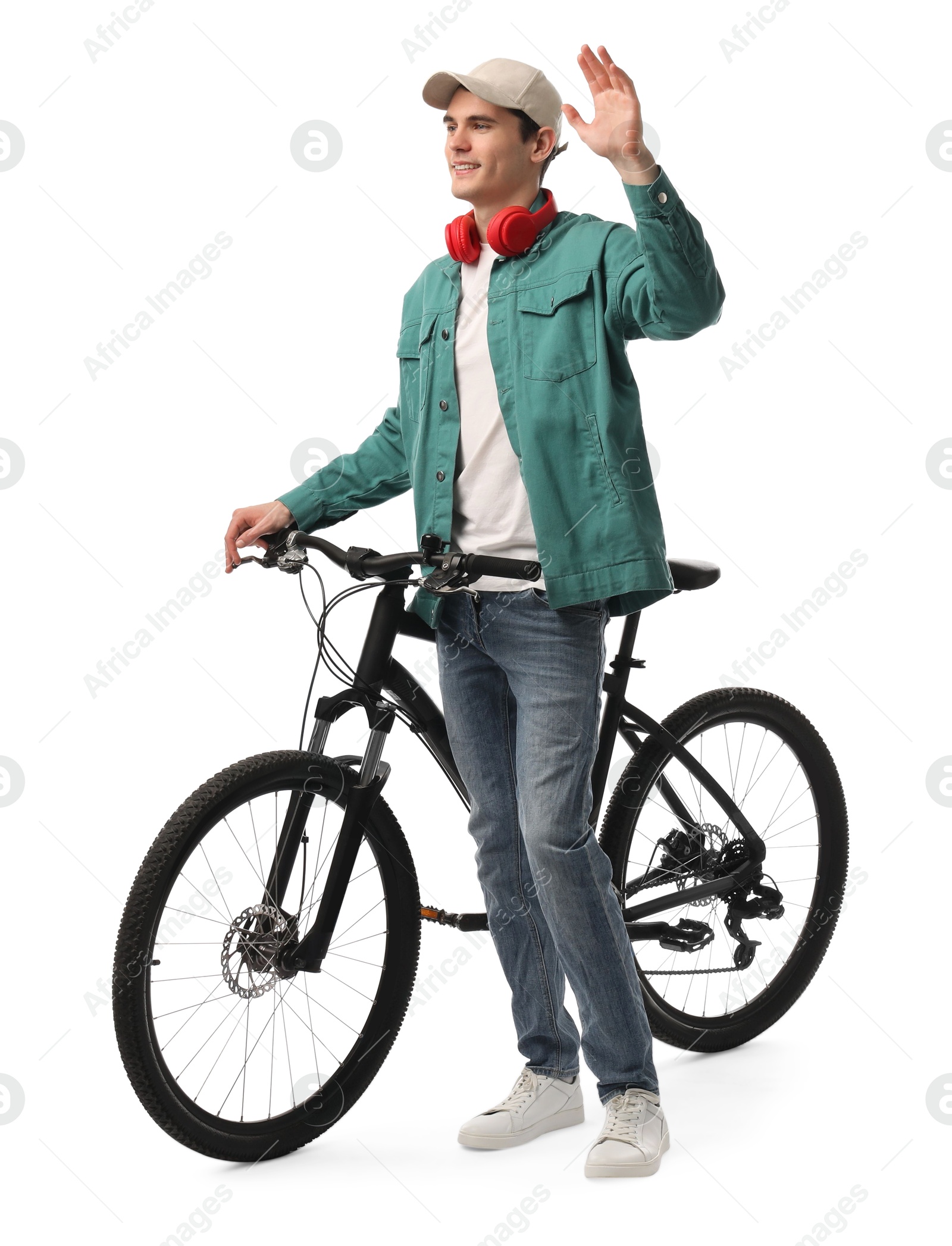 Photo of Smiling man with headphones and bicycle isolated on white