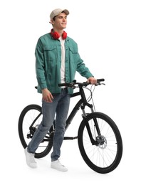 Photo of Smiling man with headphones and bicycle isolated on white