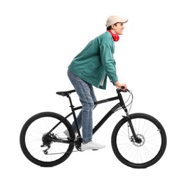 Photo of Smiling man with headphones riding bicycle on white background