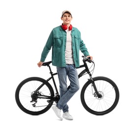 Photo of Smiling man with headphones near bicycle isolated on white