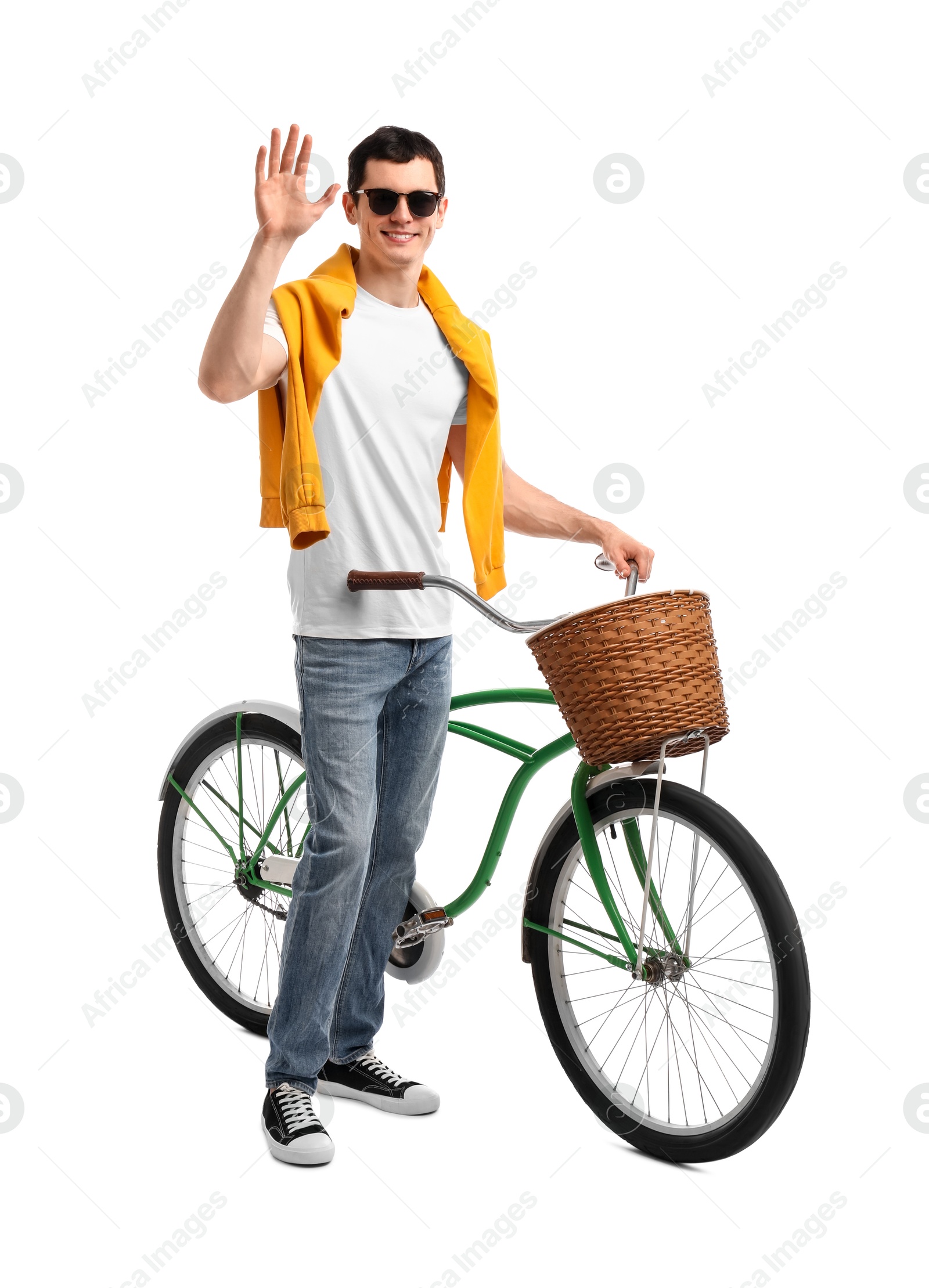 Photo of Smiling man in sunglasses near bicycle with basket isolated on white