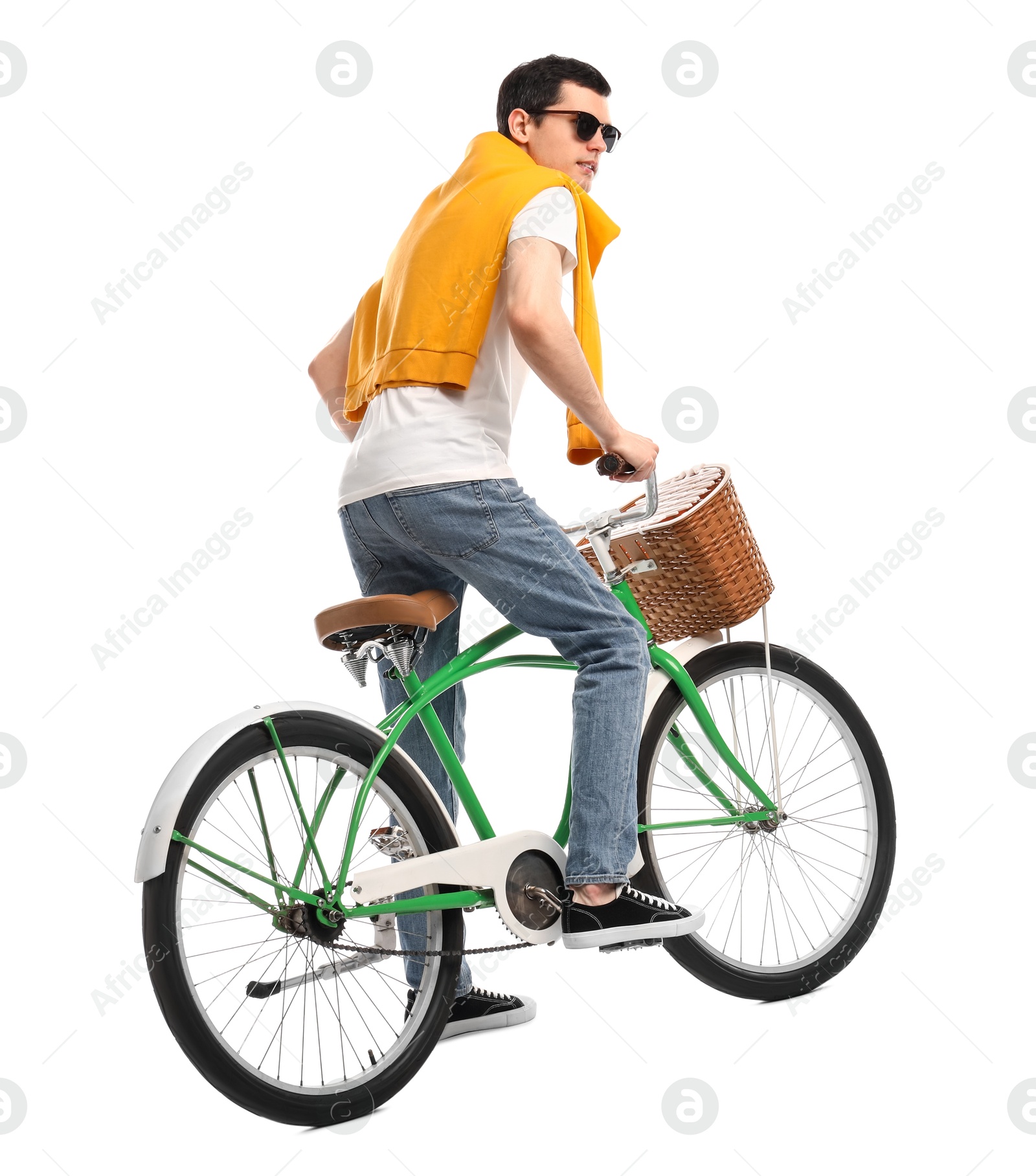 Photo of Man in sunglasses riding bicycle with basket on white background