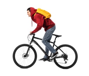 Smiling man with backpack riding bicycle on white background