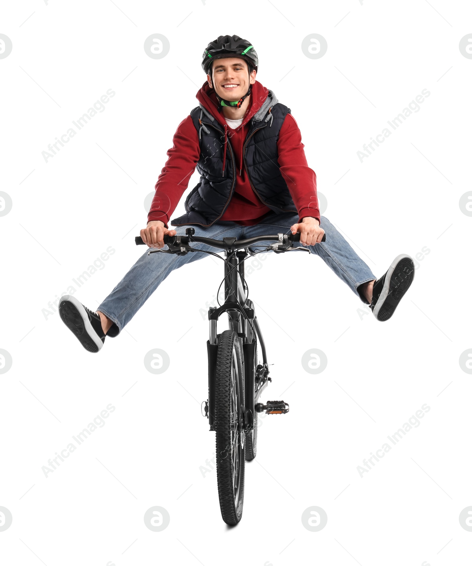 Photo of Smiling man in helmet having fun while riding bicycle on white background