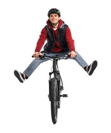 Smiling man in helmet having fun while riding bicycle on white background