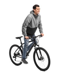 Smiling man riding bicycle on white background