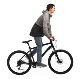 Young man riding bicycle on white background